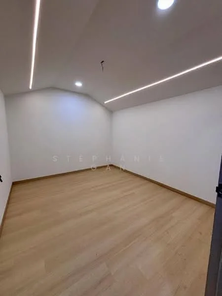 Room features: white painted walls, wooden flooring, recessed LED downlights, sloped ceiling, no visible windows, single door, neutral color scheme; style: modern.