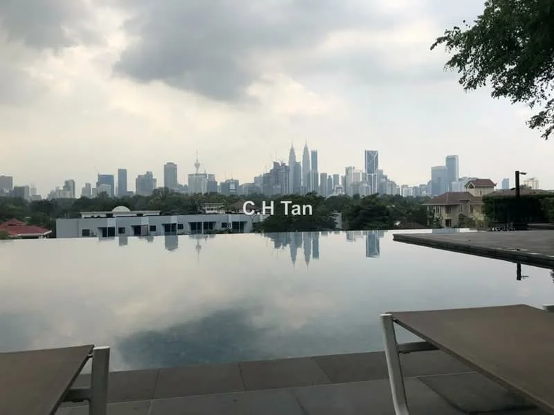 Exterior type: swimming pool deck; features: infinity pool, pool deck with loungers, city skyline view, surrounded by greenery, urban landscape, cloudy sky; style: modern.