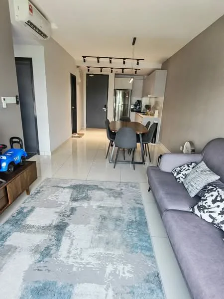 Living features: grey fabric sofa, decorative cushions, area rug with geometric pattern, wall-mounted split AC, recessed LED downlights, dining table with black chairs, open-plan layout, white tiled flooring, grey painted walls; style: modern. Dining features: dining table, black dining chairs, white cabinetry, stainless-steel fridge, kitchen countertop, open shelving; style: modern.