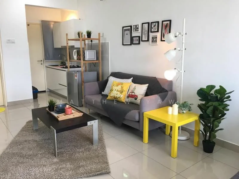 Living features: grey fabric sofa, yellow accent cushions, coffee table with wooden top and metal legs, area rug with neutral color, floor lamp with multiple shades, decorative houseplants in ceramic pots, framed artwork on walls, open kitchen area visible in background, white painted walls, glossy tile flooring; style: modern.