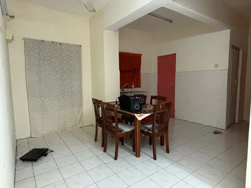 Dining features: white tiled flooring, cream painted walls, dining table with four wooden chairs, window with sheer curtains, kitchenette area visible, red curtain, doorway leading to another room, decorative tablecloth.