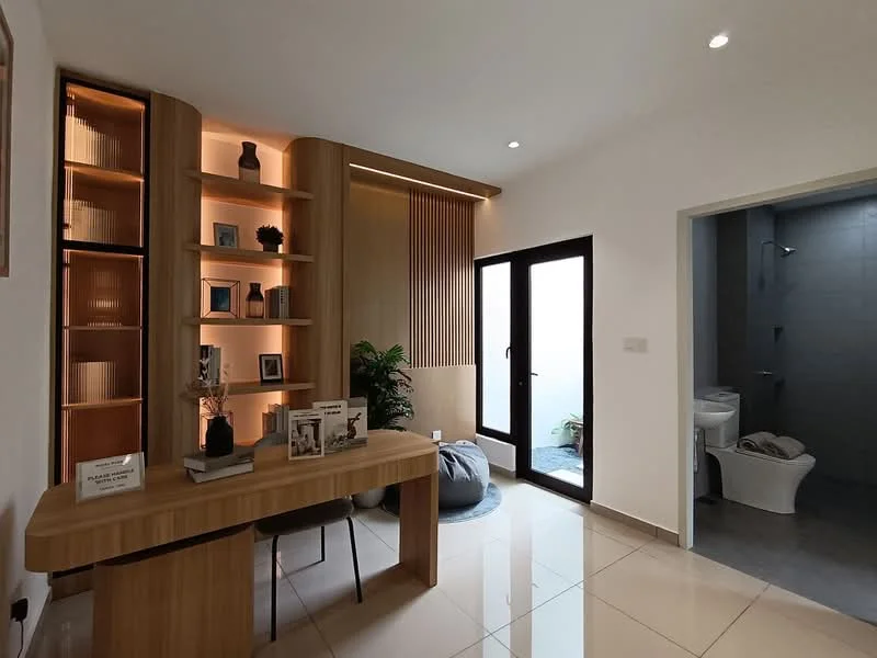 Room features: wooden desk, built-in wooden shelving, decorative vases, indirect lighting, green indoor plant, floor-to-ceiling windows, white walls, glossy tile flooring, bathroom door, toilet visible through door; style: modern.