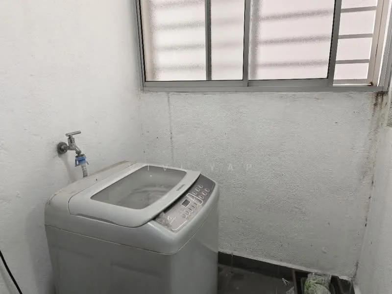 Laundry features: top-load washing machine, white walls, grey tiled flooring, window with horizontal slats, water tap, drainage area.