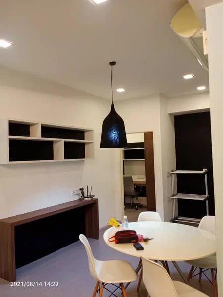 Dining features: round dining table, white dining chairs, black pendant light, wall-mounted shelves, wooden sideboard, white walls, recessed ceiling lights, grey flooring; style: modern.