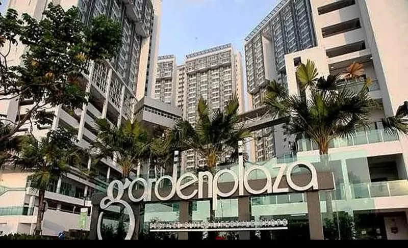 Exterior type: high-rise condominium; features: glass curtain wall, white painted facade, recessed balconies, palm trees, manicured landscaping, multiple storeys, modern signage, outdoor seating area; style: modern.