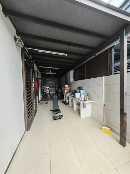 Room features: grey tiled flooring, exposed beams ceiling, ceiling fan, wall-mounted shelves, exercise bench, laundry drying rack, cleaning supplies, white wall, concrete wall, natural light from windows; style: modern.