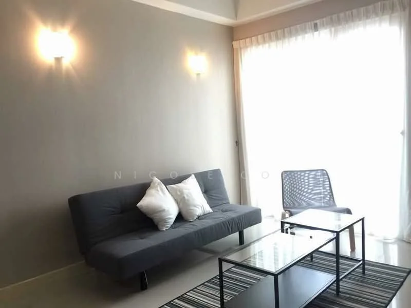 Living features: grey fabric sofa bed, two white throw pillows, glass coffee table, striped area rug, floor-to-ceiling windows, sheer curtains, wall-mounted sconces, light grey painted walls, neutral tile flooring; style: modern.