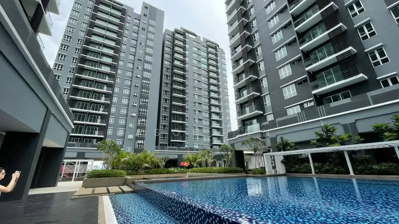 Exterior type: high-rise condominium; features: infinity pool, pool deck with loungers, landscaped garden with tropical plants, multiple high-rise buildings, glass curtain wall facade, balconies on upper floors, manicured lawn, paved walkway, outdoor seating area; style: modern.