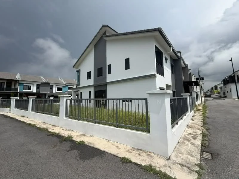 Exterior type: semi-detached house; features: white painted facade, grey accent wall, flat roof, manicured lawn, fenced perimeter, two-storey structure, driveway, surrounded by greenery; style: modern.