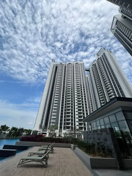 Exterior type: high-rise condominium; features: glass curtain wall, white painted facade, multiple balconies, swimming pool deck, outdoor lounge chairs, manicured landscaping, modern architectural design, surrounded by greenery; style: modern.