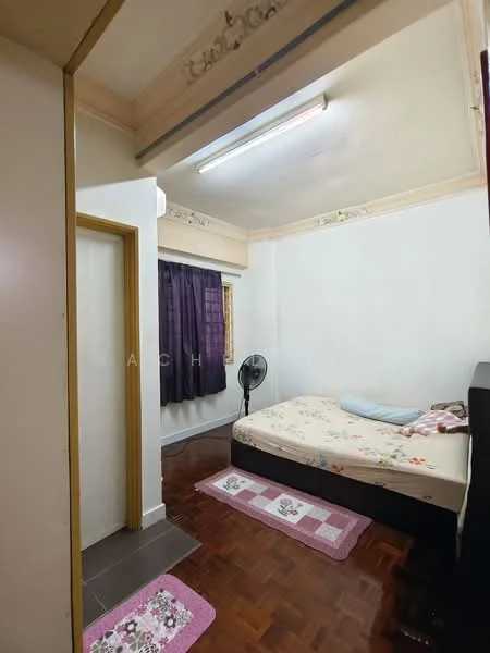 Bedroom features: wooden flooring, white painted walls, ceiling fan, queen-size bed with floral bedding, purple curtains, decorative area rug, nightstand, wall-mounted mirror.