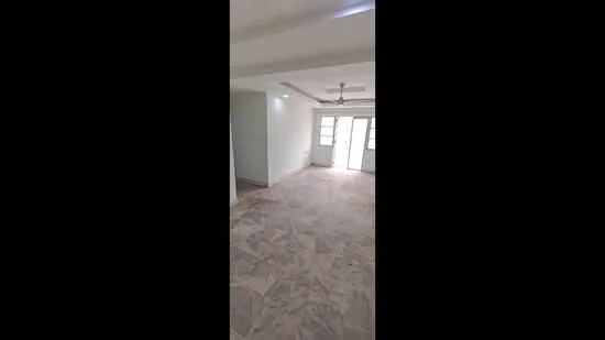 Room features: marble flooring, white painted walls, ceiling fan, sliding glass door, multiple windows, recessed lighting, open layout, natural light; style: modern.