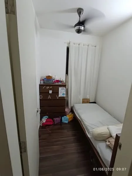 Bedroom features: single bed, wooden bed frame, light-colored bedding, ceiling fan, white walls, dark wood flooring, window with sheer curtains, wooden dresser, colorful storage bags on the floor.