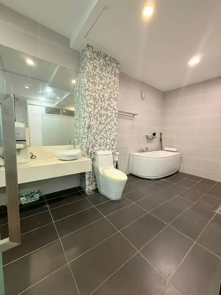 Bathroom features: double-sink vanity with white countertop, wall-mounted mirror, freestanding bathtub, one-piece toilet, grey tiled walls, black floor tiles, shower area with glass partition, modern faucet fixtures; style: modern.