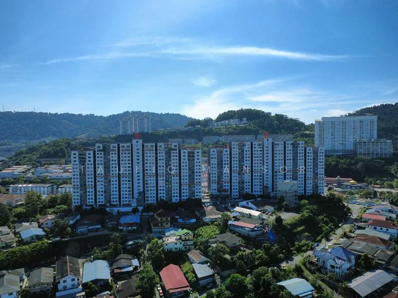 Exterior type: high-rise condominium; features: white painted facade, glass curtain wall, approximately 15-storey high-rise, surrounded by mature greenery, adjacent to residential area, multiple balconies, landscaped garden at base, parking area visible; style: modern.