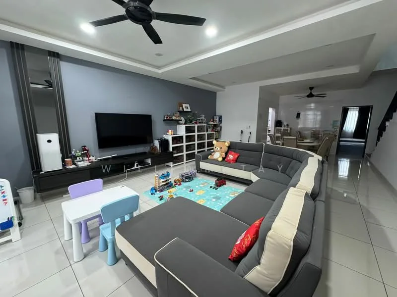 Living features: L-shape sectional sofa in grey, coffee table, TV console, wall-mounted TV, area rug with geometric pattern, ceiling fan, recessed downlights, white painted walls, grey accent wall, polished tile flooring, decorative items on shelves, children's play area with small table and chairs; style: modern.