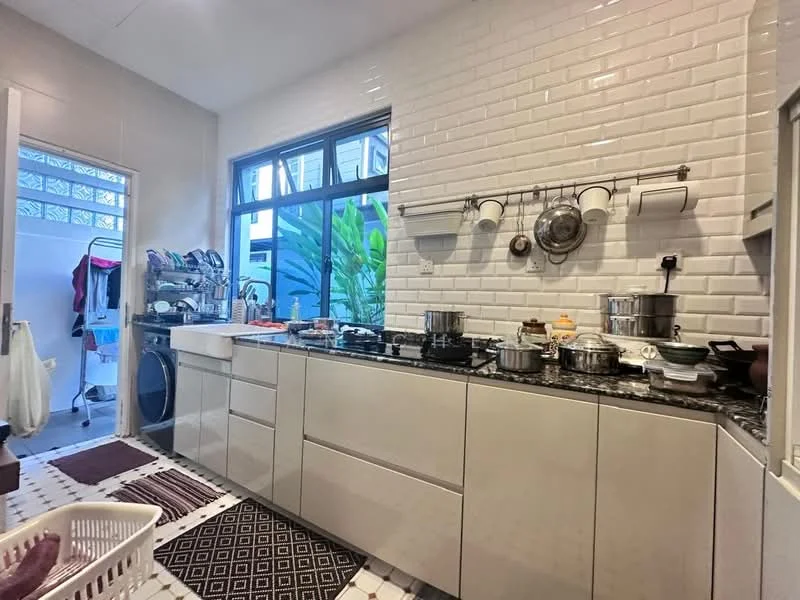 Kitchen features: white subway tile backsplash, granite countertop, single-bowl stainless-steel sink, chrome pull-down faucet, built-in cabinets with flat-panel design, stainless-steel pots and pans, stainless-steel stove, washing machine, black and white patterned floor tiles, open shelving, window with view of greenery, multiple cooking utensils; style: modern; view: garden. Room features: laundry basket, white walls, door leading to laundry area.