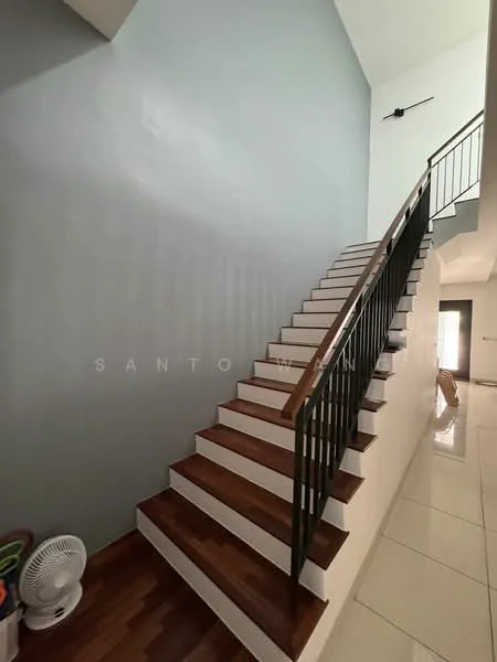 Room features: wooden staircase with white risers, grey painted walls, high ceiling, ceramic tile flooring, black metal railing, ceiling light fixture, fan, open space at the bottom of the stairs; style: modern.