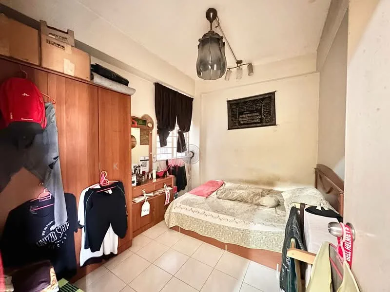 Bedroom features: queen-size bed with patterned bedding, wooden headboard, built-in wardrobe with sliding doors, mirror on dresser, decorative wall art, hanging light fixture, curtains on window, tile flooring.