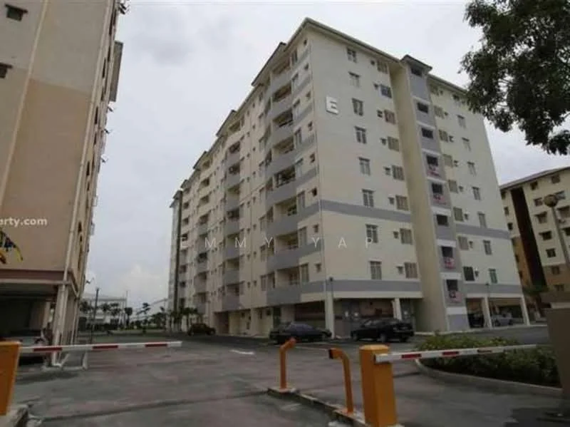 Exterior type: low-rise apartment block; features: cream painted facade, multiple storeys, balconies on upper floors, parking area in front, security barrier at entrance, surrounded by open space; style: modern.