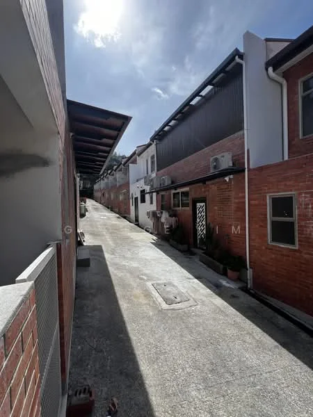 Exterior type: linked terrace house; features: red brick facade, white painted facade, visible air conditioning units, concrete pathway, manicured landscaping with potted plants, single-storey, surrounded by residential buildings, clear blue sky; style: modern.