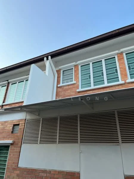 Exterior type: linked terrace house; features: red brick facade, white painted facade, horizontal louvre windows, flat roof, awnings over windows, ventilation grilles, two-storey structure; style: modern.