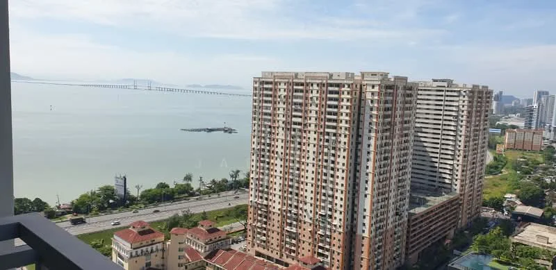 Exterior type: high-rise condominium; features: view of the sea, city skyline in background, surrounded by greenery, adjacent to highway, multiple high-rise buildings, waterfront location; style: modern.