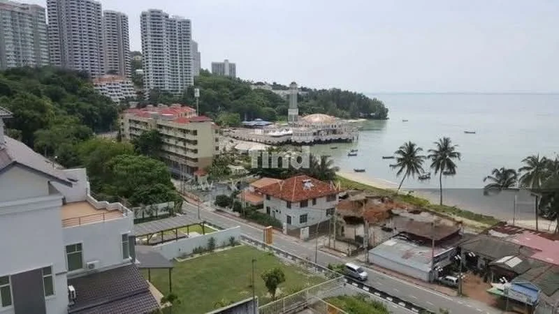 Exterior type: high-rise condominium; features: waterfront view, surrounded by greenery, multiple high-rise buildings, coastal road, beachfront area, boats in the water, palm trees, mixed-use development, nearby lighthouse, urban context; style: modern.