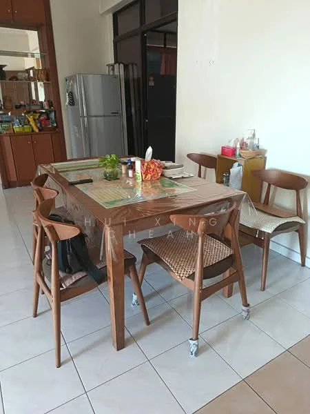 Dining features: wooden dining table, 6-seater dining table, brown wooden chairs, woven seat dining chairs, tablecloth, centerpiece with flowers, ceramic vase, glass water jug, cutlery set, white plates, napkins, tile flooring, refrigerator visible in background, open shelving with kitchen items; style: modern.