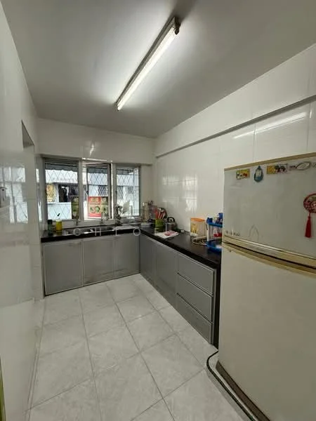 Kitchen features: white tiled walls, grey laminate cabinetry, black granite countertop, stainless-steel sink, chrome pull-down faucet, freestanding fridge, built-in oven, ceramic tile flooring, window with security grille, overhead fluorescent lighting, open shelving, kitchen utensils on countertop; style: modern.