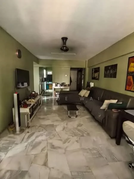 Living features: marble flooring, green painted walls, 5-blade ceiling fan, wall-mounted TV, TV console, sofa in grey, coffee table, decorative artwork, open layout to kitchen, natural light from windows; style: modern.