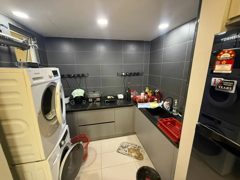 Laundry features: white front-load washing machine, white tumble dryer, black countertop, grey tile backsplash, grey wall tiles, built-in cabinetry, red dish rack, black sink, multiple electrical outlets, floor tiles, laundry basket, decorative mat; style: modern.