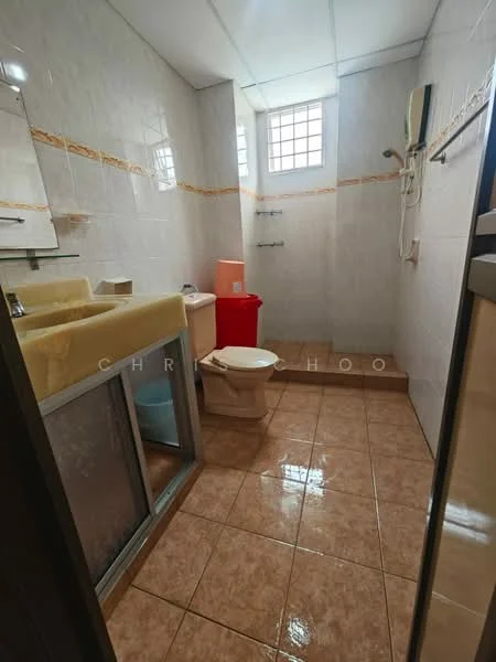 Bathroom features: white tiled walls, cream tiled flooring, single-sink vanity with beige countertop, mirror above sink, toilet, shower with wall-mounted faucet, red trash bin, window with grid pattern, shower curtain, wall-mounted water heater.