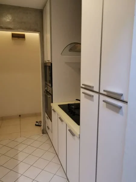 Kitchen features: white cabinetry with sleek handles, built-in oven, built-in microwave, gas cooktop, light-colored countertop, white tiled flooring, wall-mounted range hood, recessed lighting, neutral wall color, open shelving, corner cabinet; style: modern.