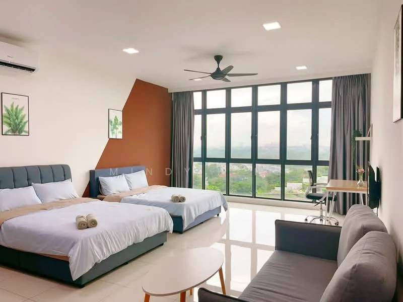 Bedroom features: 2 queen-size beds with grey upholstered headboards, white bedding with decorative throw pillows, floor-to-ceiling windows with city view, grey curtains, 3-blade ceiling fan with light, white painted walls, light-colored tiled flooring, small round coffee table, sofa in grey fabric, study desk with chair, wall-mounted air conditioning unit, framed artwork on walls; style: modern; view: city.