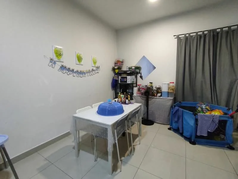 Dining features: white dining table, 4 white chairs, grey curtains, tile flooring, wall-mounted decorations, microwave, kitchen storage cabinet, blue storage container, bottles and jars on table, blue tablecloth.