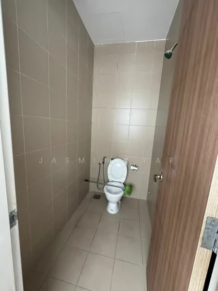 Bathroom features: one-piece toilet, wall-mounted bidet spray, tile flooring, beige tiled walls, shower head, single towel rack, door with wood finish.