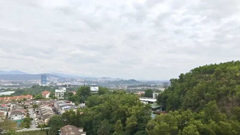 Exterior features: city skyline view, surrounded by greenery, hills in background, residential area, cloudy sky.
