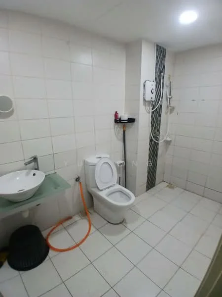 Bathroom features: white tiled walls, white tiled flooring, single-bowl sink, chrome faucet, one-piece toilet, shower area with handheld shower, wall-mounted water heater, black waste bin, orange hose, grey accent wall with tiles, recessed lighting; style: modern.
