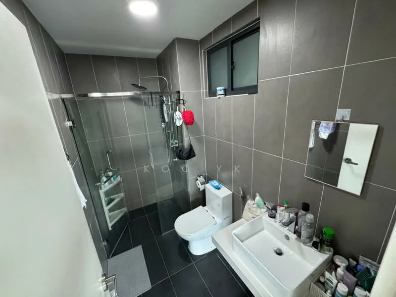 Bathroom features: grey tiled walls, black tiled flooring, walk-in shower with glass enclosure, rain shower head, handheld shower, single-sink vanity with white cabinet, chrome basin mixer faucet, toilet, framed mirror, window, shelf with toiletries, bath mat; style: modern.