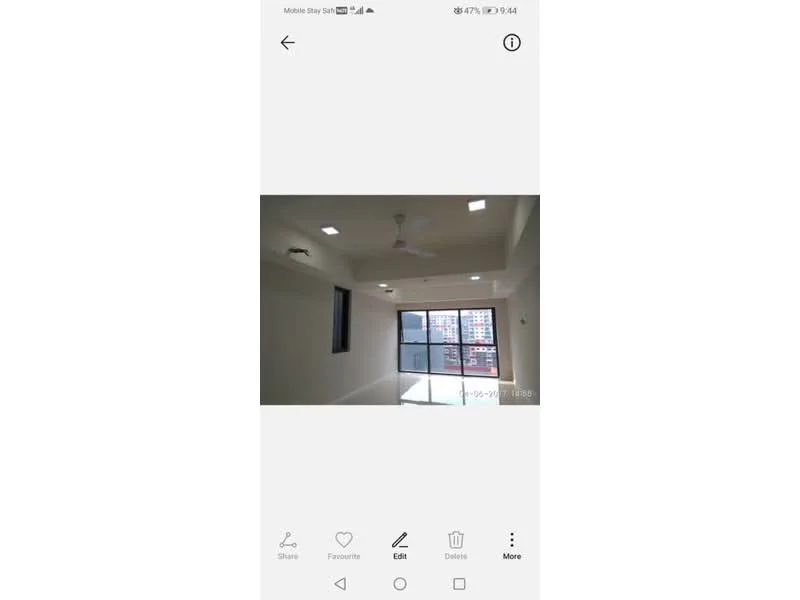 Room features: white painted walls, polished concrete flooring, 5-blade ceiling fan with light, recessed LED downlights, floor-to-ceiling windows, city view; style: modern; view: city.