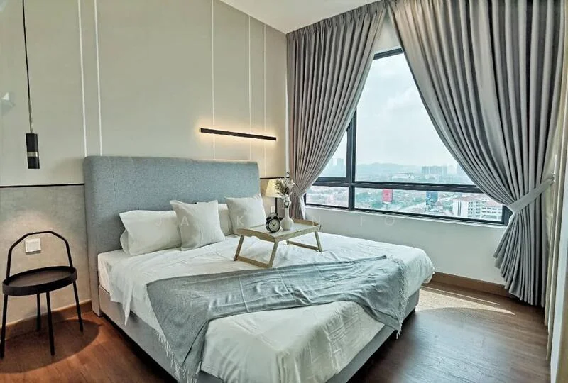 Bedroom features: king-size bed, upholstered headboard, white bedding, decorative throw blanket, bedside table, black chair, floor-to-ceiling window, grey curtains, wooden flooring, wall-mounted light fixture, decorative vase with flowers; style: modern; view: city.