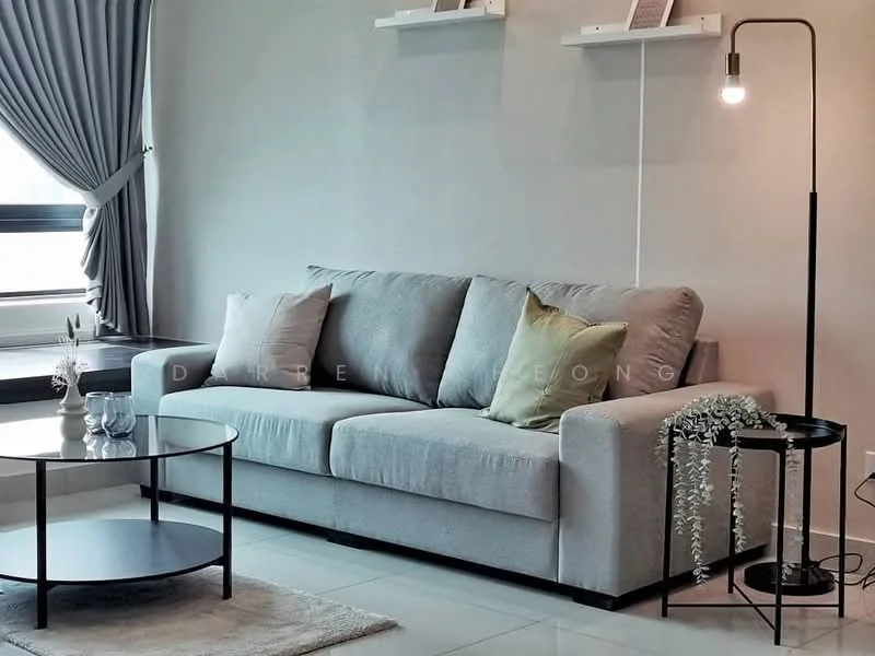 Living features: 3-seater fabric sofa in grey, 2 decorative cushions in green and beige, round glass coffee table with black metal frame, black floor lamp with exposed bulb, light grey walls, white shelves mounted on the wall, curtains in light grey, tile flooring in white, decorative plant on the coffee table; style: modern.