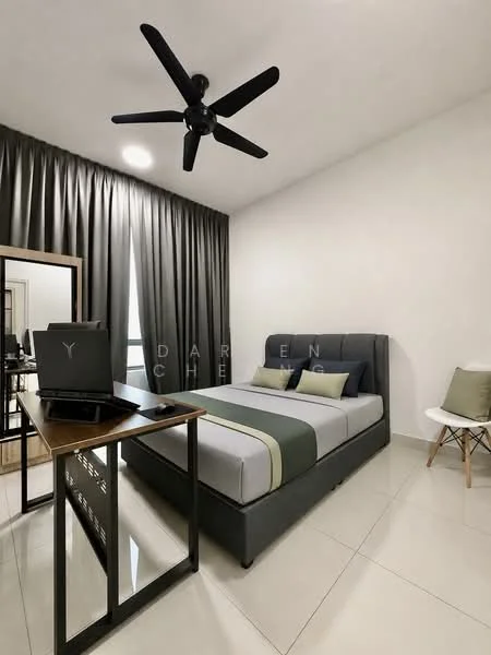 Bedroom features: king-size bed with grey upholstered headboard, grey bedding with green accent, 2 bedside pillows, wooden study desk, black laptop on desk, white chair, floor-to-ceiling curtains in dark grey, white painted walls, polished tile flooring, 5-blade ceiling fan with light, full-length mirror, decorative cushions on chair; style: modern.