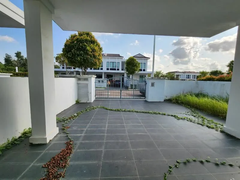 Exterior type: detached bungalow; features: paved walkway, manicured lawn, landscaping with grass, fenced perimeter, gated entry, surrounding greenery, two-storey house in background, cloudy sky; style: modern.