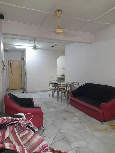 Living features: 2-seater black fabric sofa, 3-seater red fabric sofa, round dining table with metal legs, 4 metal dining chairs, marble flooring, ceiling fan, white painted walls, door leading to hallway, kitchen visible in background.