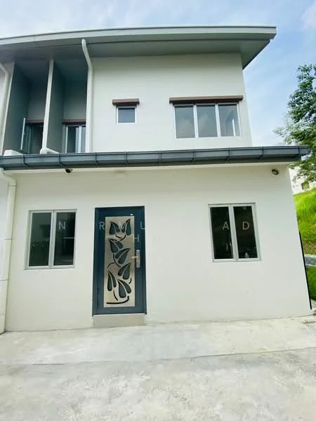 Exterior type: semi-detached house; features: white painted facade, metal door with decorative cut-out design, large windows, flat roof, concrete driveway, green landscaping in background; style: modern.