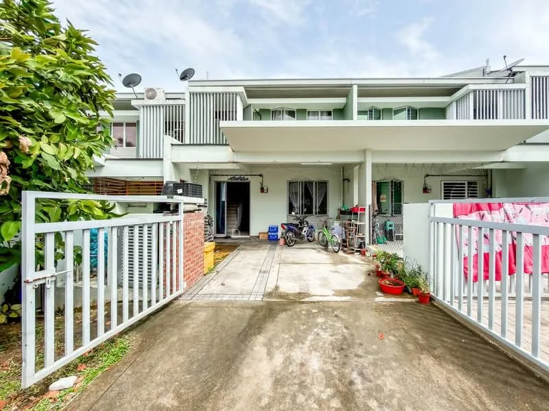 Exterior type: linked terrace house; features: two-storey building, white painted facade, balconies on upper floor, front porch with concrete flooring, brick wall at entrance, manicured garden with plants, bicycle parked in front, laundry hanging on balcony, satellite dishes on roof, driveway with interlocking pavers; style: modern.