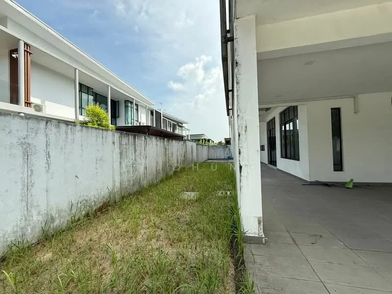 Exterior type: detached bungalow; features: concrete walls, grass lawn, paved walkway, large windows, white painted facade, two-storey structure, surrounded by greenery, open space, clear blue sky; style: modern.