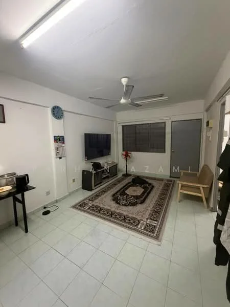 Living features: white painted walls, tiled flooring in light green, 5-blade ceiling fan, wall-mounted TV, coffee table, area rug with intricate pattern, decorative wall clock, window with grilles, door leading to another room, wooden chair.